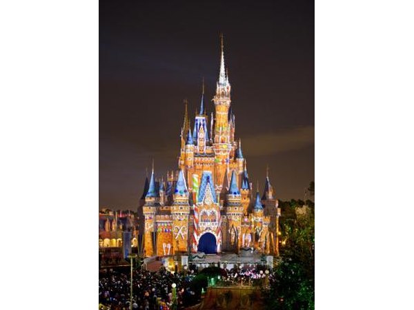 Cinderella's Castle decorated like a gingerbread house for Christmas.