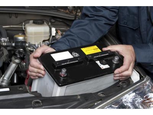 Man removing car battery