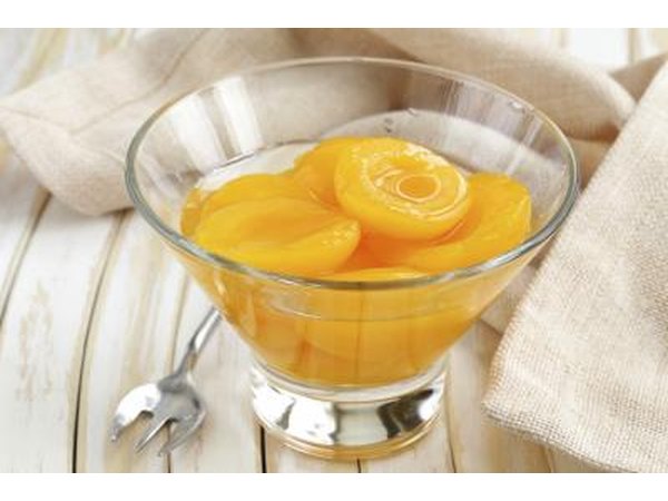 Small dish filled with canned peaches.