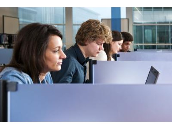 Woman using computer at library