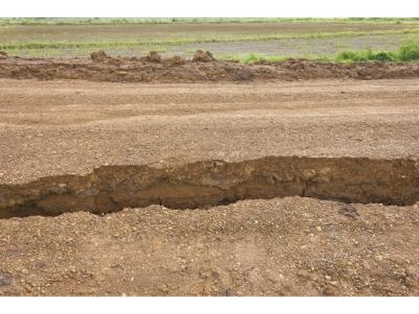 A large split in sandy soil from an earthquake.
