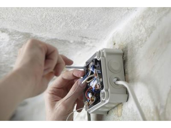 Worker installing electrical box