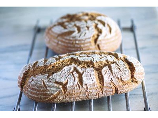 Two freshly baked loaves of rye bread.
