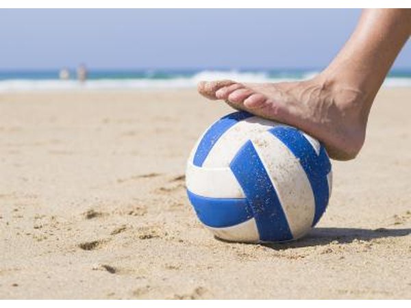 Foot stepping on a ball.