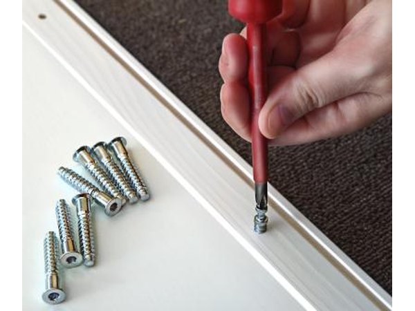 Secure the clamps with a Phillips-head screwdriver.