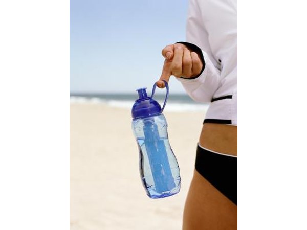 Woman holding bottle of water