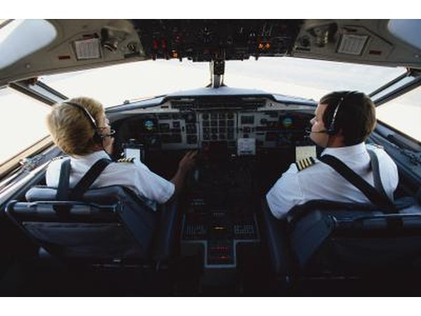 Two pilots in a planes cockpit.
