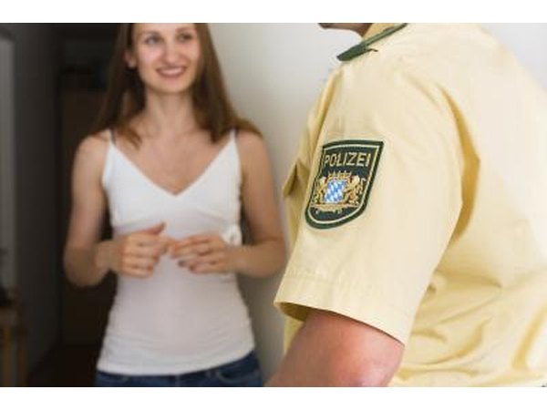 Police officer talking to female witness.