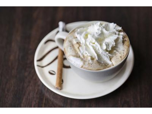 Whipped cream on a cup of coffee.