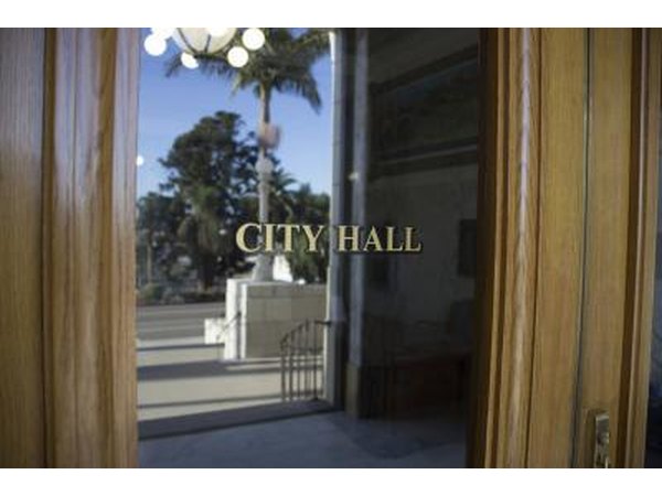 A close-up of the front door of a city hall.
