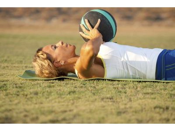 Working out with a medicine ball.