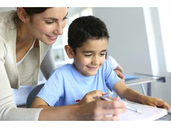 Teacher helping student with homework
