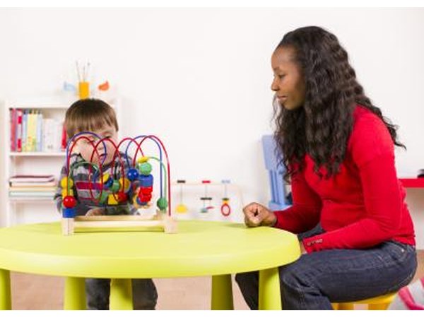 day care worker talking to toddler