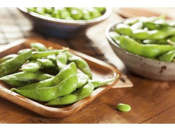 Cooked edamame in small bowls.