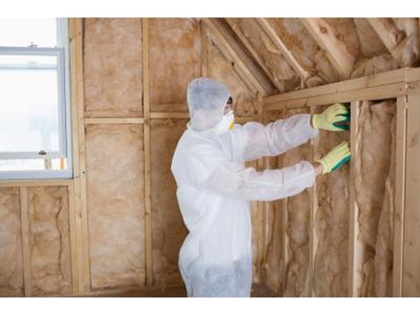 Man installing insulation