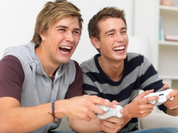Friends playing video game at home