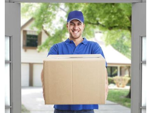Delivery man holding a box