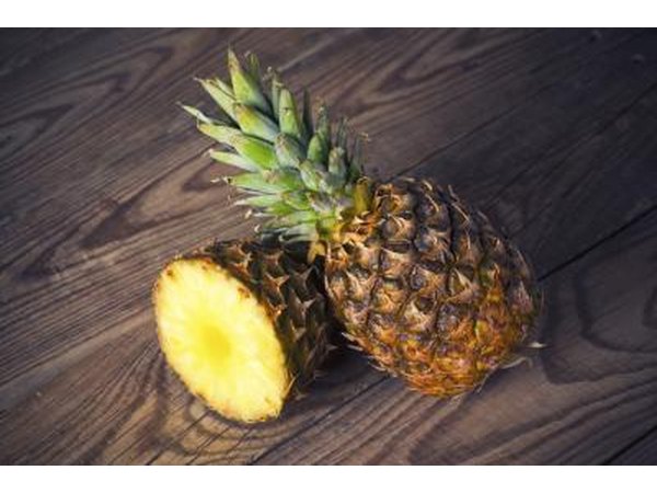 Halved and whole pineapple.