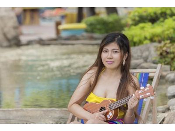 Young woman playing the ukelele.