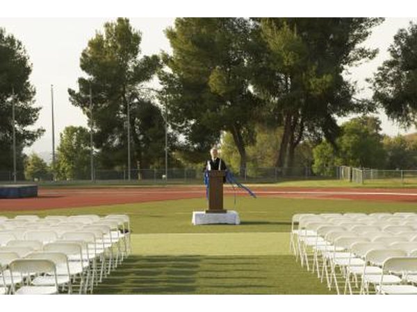 A speaker practices at the podium before an event.