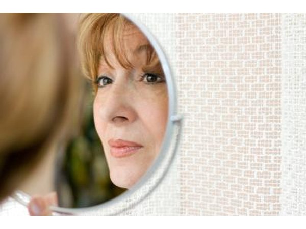 Woman looking in mirror