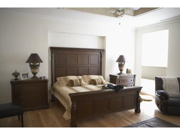 Pink and white make a handsome complement for this bedroom's wood furniture.