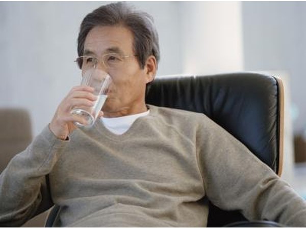 Senior man drinking a glass of water