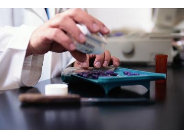 Pharmacist filling pills