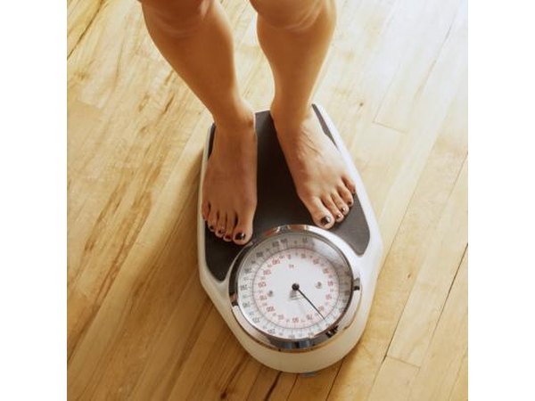 Woman on a bathroon scale