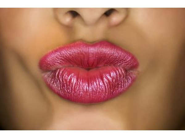 Make your mouth into an "o".