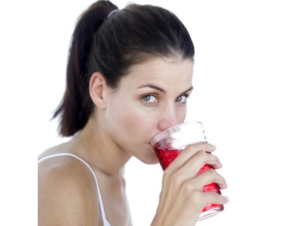 Woman drinking cranberry juice