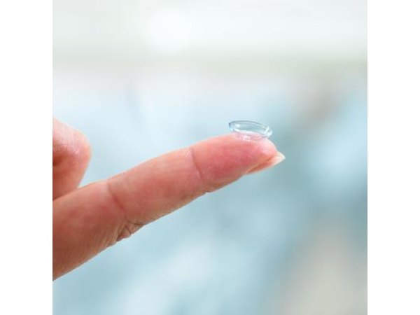 Contact lens on fingertip.