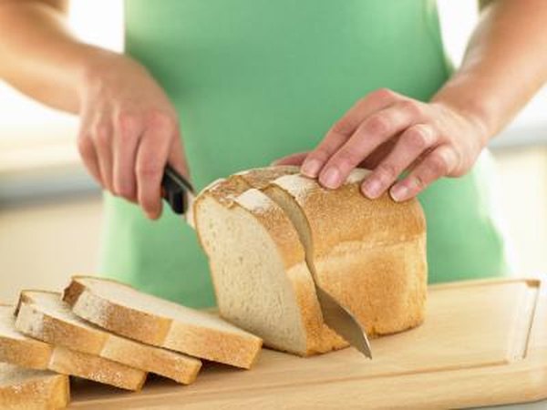 woman slicing bread