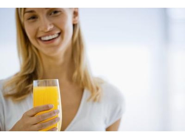 Woman drinking orange juice