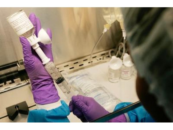 Chemotherapy medication being mixed by pharmacist
