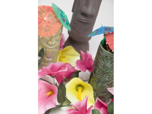 Bright drink umbrellas and blossoms set the tropical tone for your tiki bar.