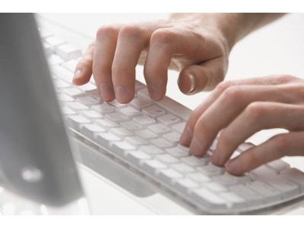 Person typing on keyboard