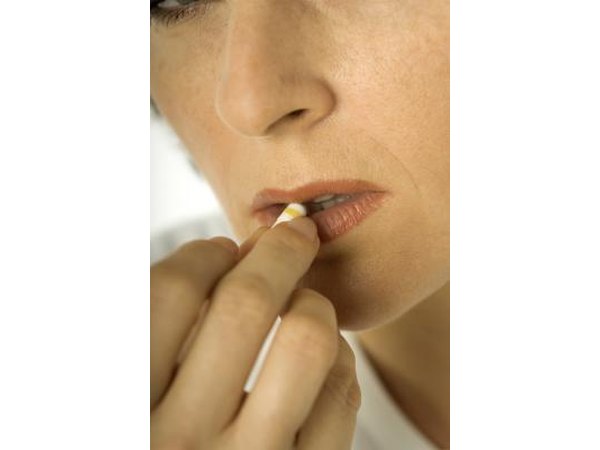woman taking a pill