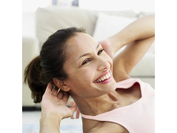 Woman twisting shoulder to knee