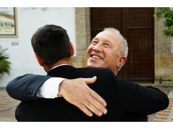 Father and son hugging.