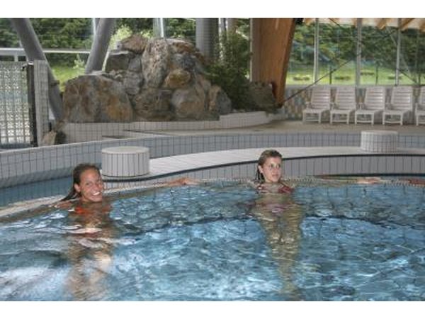 Two women in large indoor hot tub