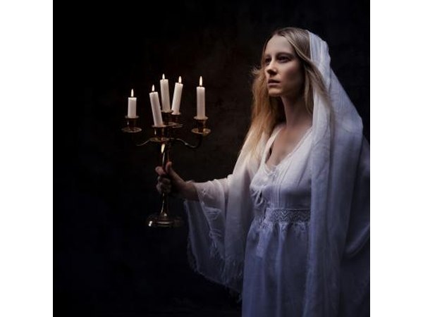 Young girl holding candles