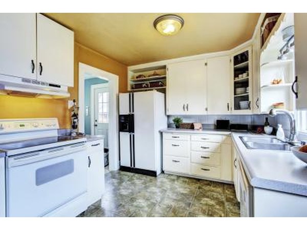 Kitchen with ceiling painted a pretty taupe color.