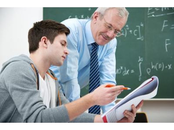 Professor talking to student in college