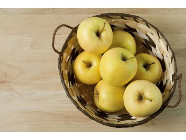 Golden Delicious apples are large, firm and green or golden in color.