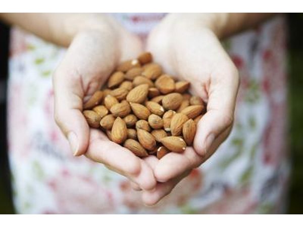 Woman with almonds in her hands