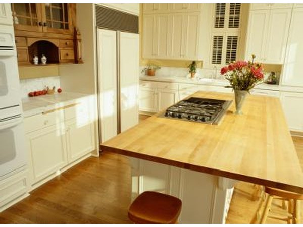Cabinets have been painted white in a modern kitchen.