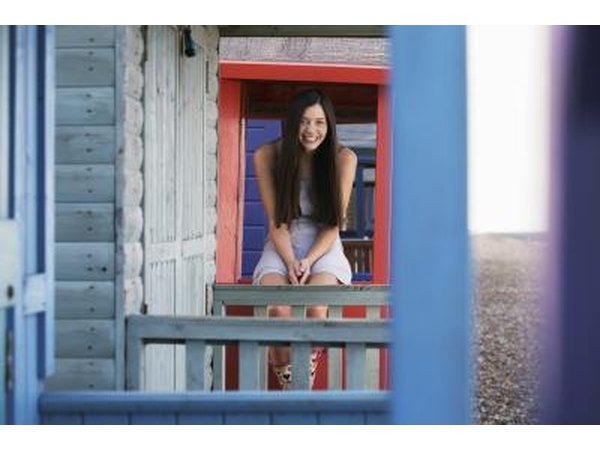 A close-up of blue trim on the porch of a beach house.