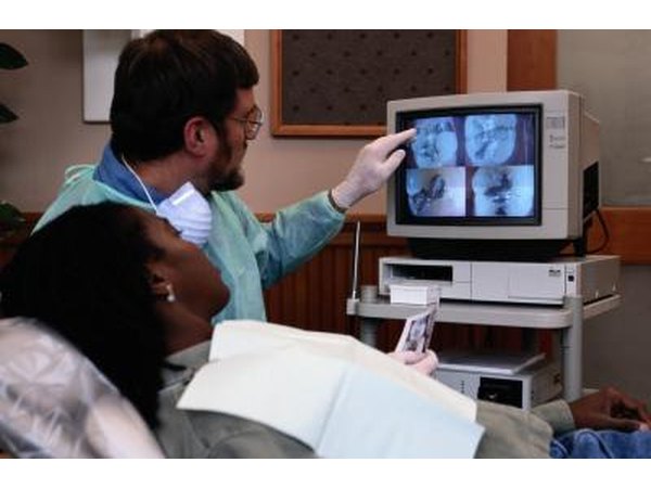 Dentist explaining diagnostic images.