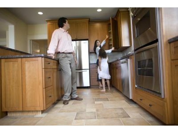 Family standing in kitchen.